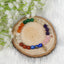 7 Chakra Crystal Bracelet on a wooden plate