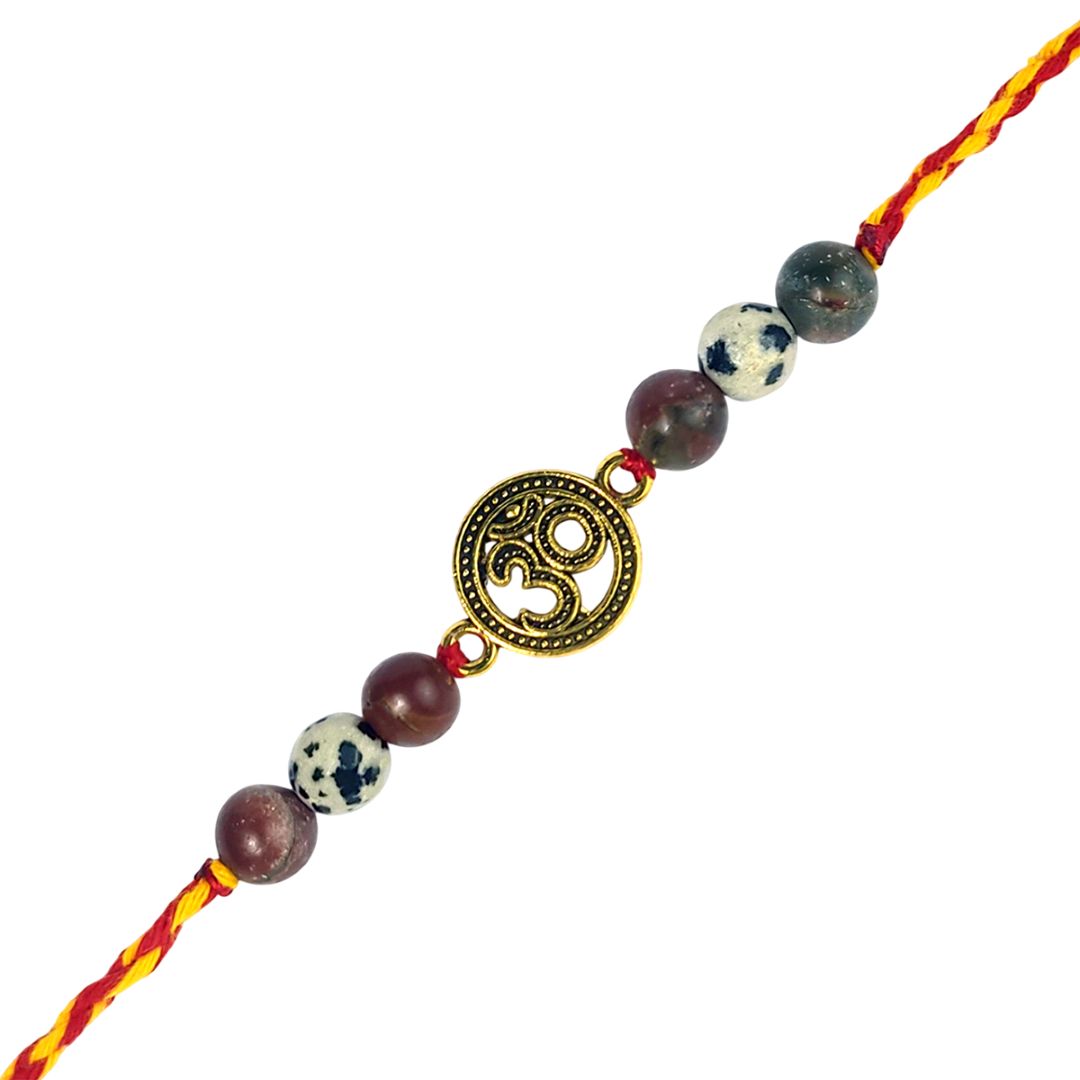 Bracelet with beads and a gold Om symbol charm on a white background