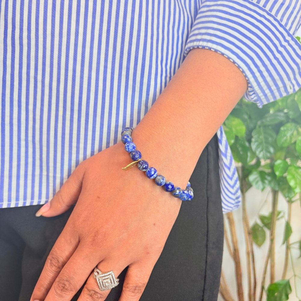 woman wearing a Lapis Lazuli Crystal bracelet on her left hand