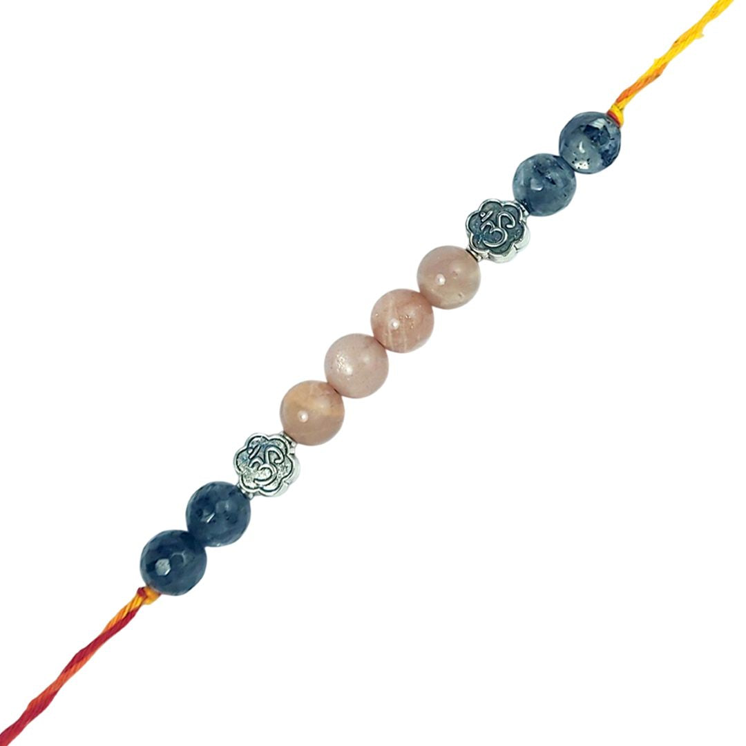 Beaded rakhi with blue and pink beads on a white background