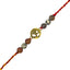 rakhi with beads and a gold charm on a white background
