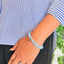woman wearing a Natural Aquamarine bracelet on her left hand