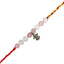 rakhi with pink and white beads and a silver charm on a white background