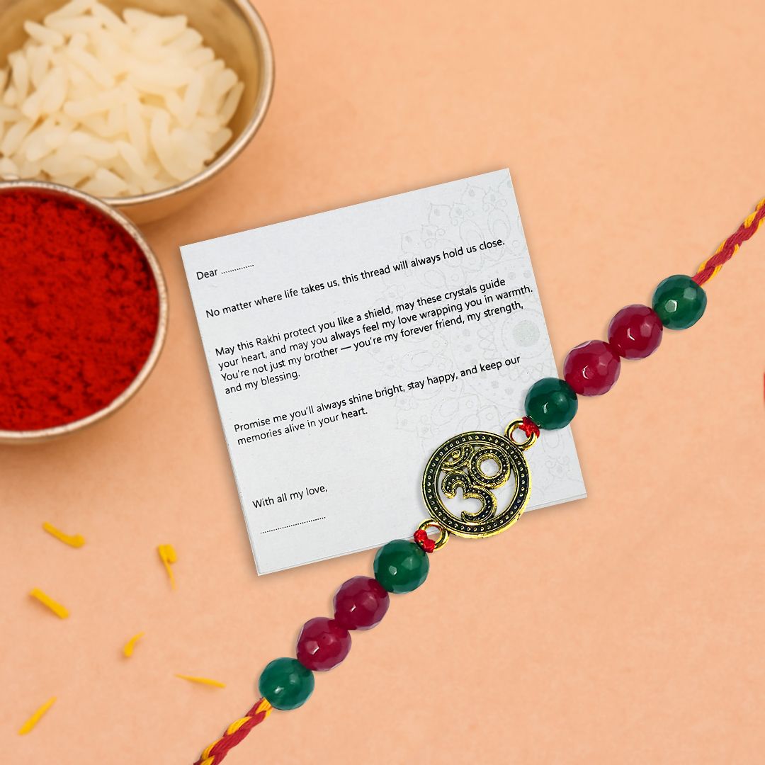 Rakhi with a message card on a peach background
