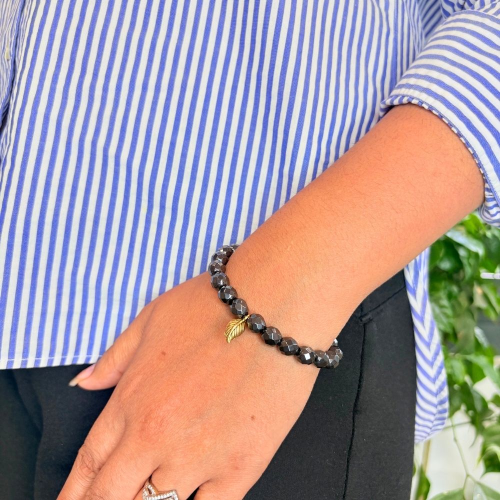woman wearing a Smoky Quartz bracelet on her left hand