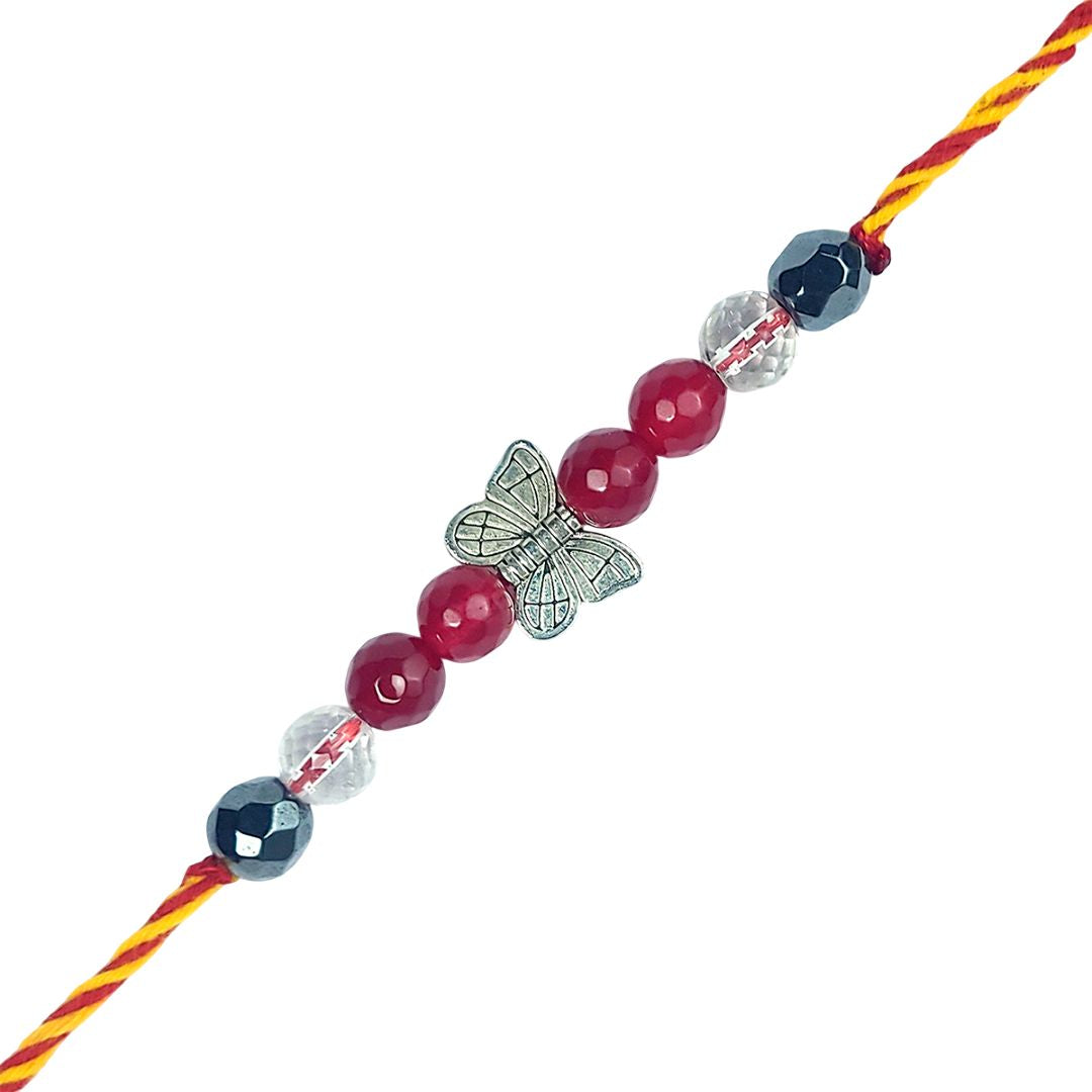 Beaded rakhi with a butterfly charm on a white background