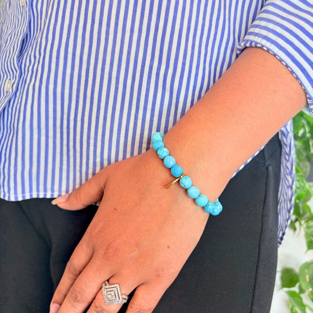 woman wearing a Turquoise Leaf Charm bracelet on her left hand