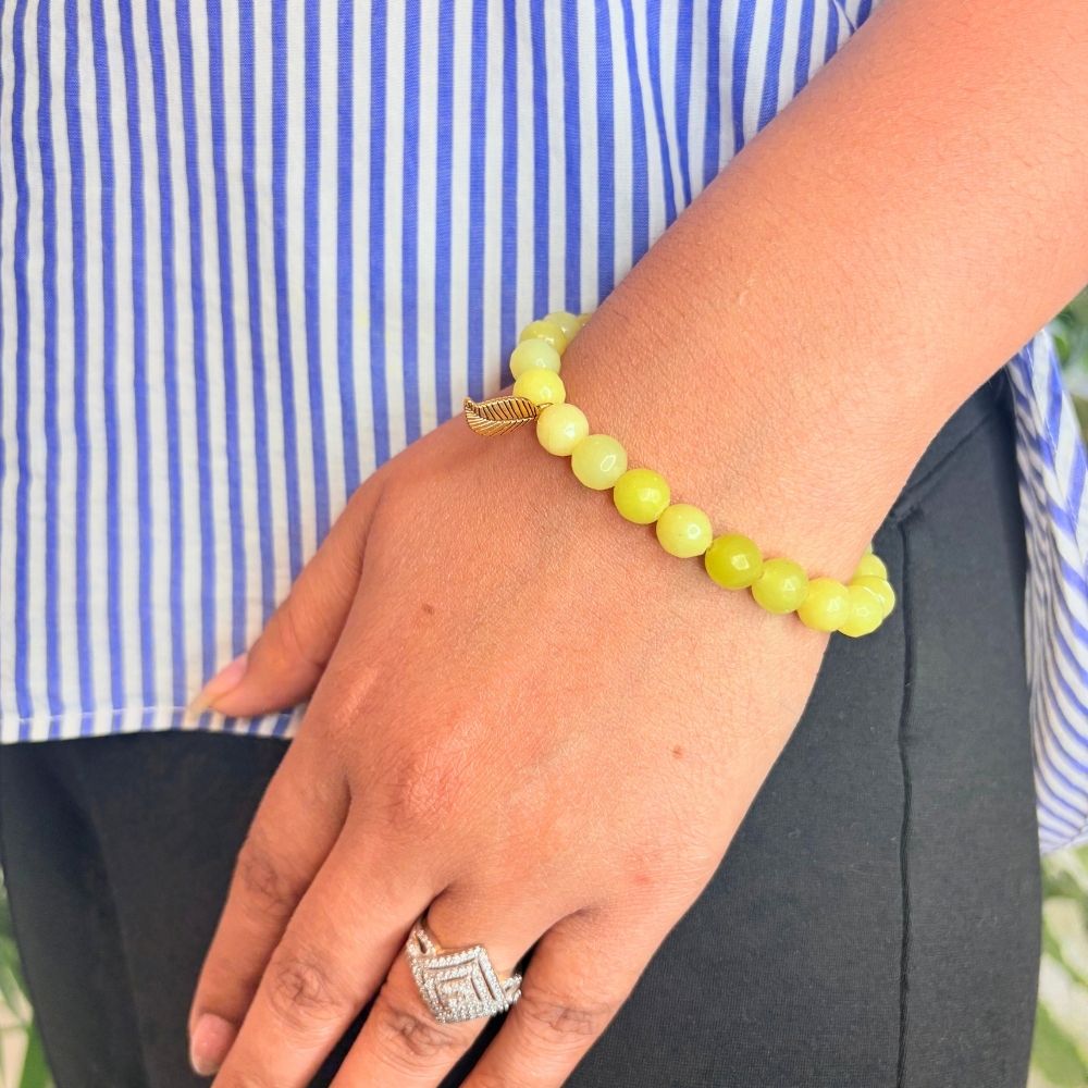 woman wearing a Yellow Aventurine bracelet on her left hand