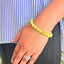 woman wearing a Yellow Aventurine bracelet on her left hand