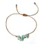 Bracelet with amazonite stones and gold accents on a white background