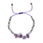 braacelet with purple and gold beads on a white background