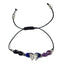 bracelet with butterfly charm and beads on a white background