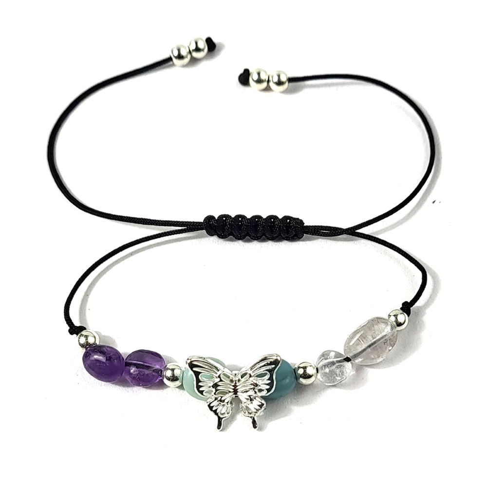 bracelet with butterfly charm and beads on a white background