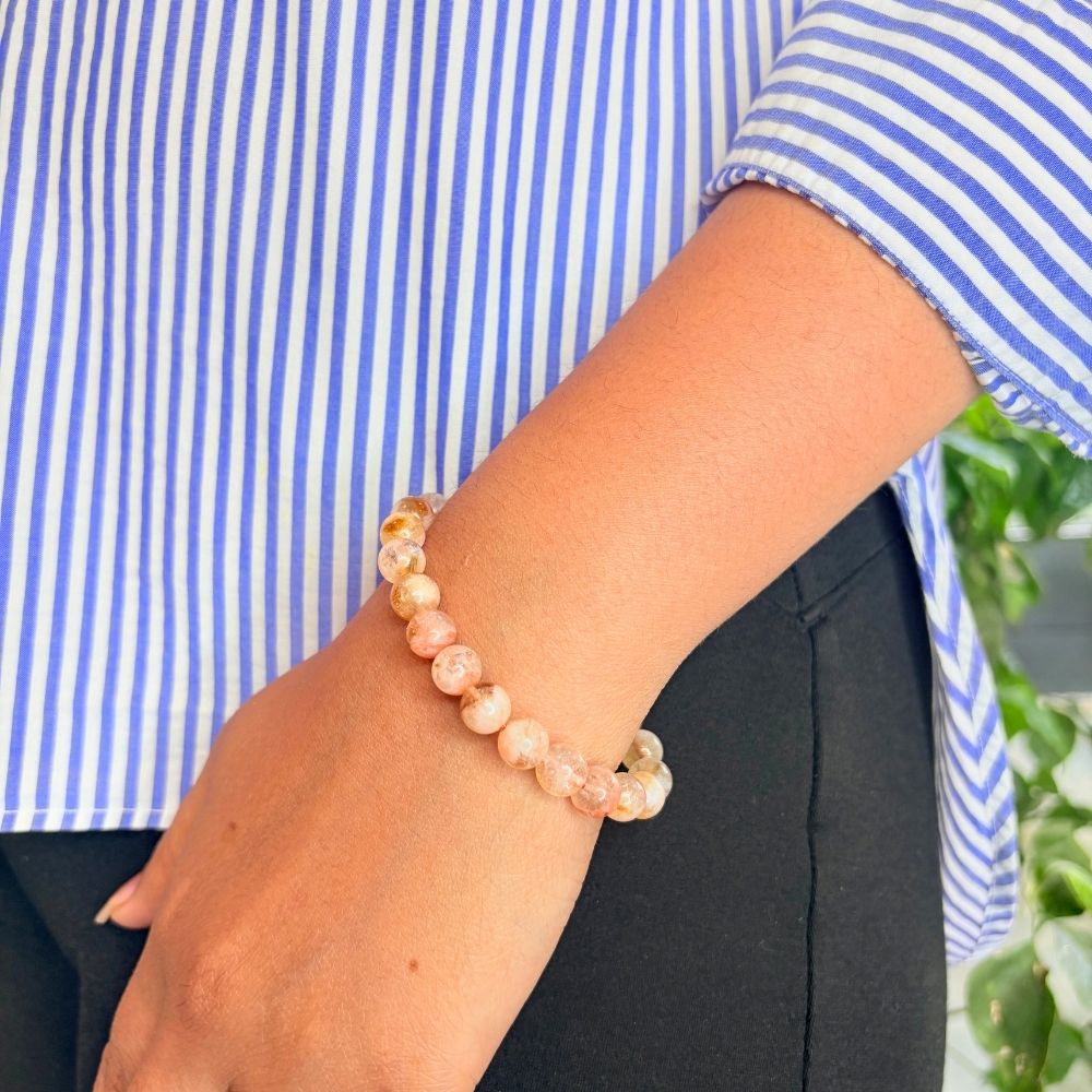 woman wearing a Natural Citrine bracelet on her left hand