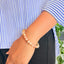 woman wearing a Natural Citrine bracelet on her left hand