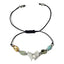 Bracelet with butterfly charm and colorful beads on a white background