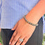 woman wearing a Pyrite Bracelet on her left hand