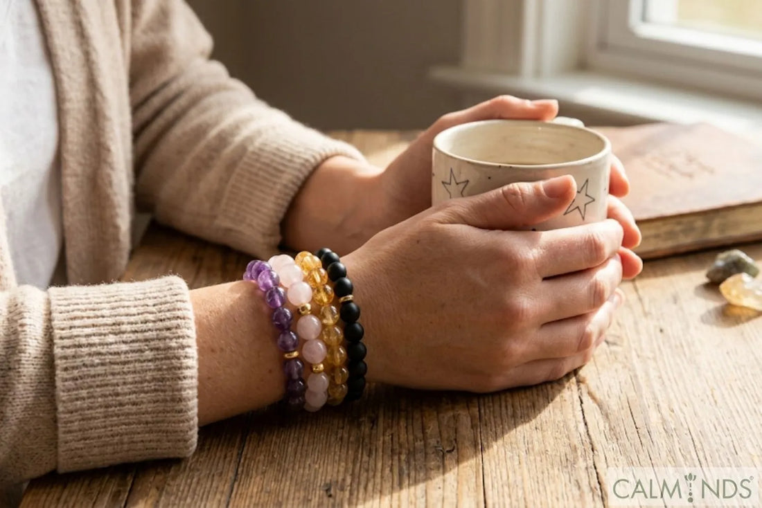 Person wearing multiple healing crystal bracelets for daily mindfulness