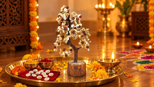Gomti chakra tree and Lakshmi puja set on a brass thali with diyas and marigolds