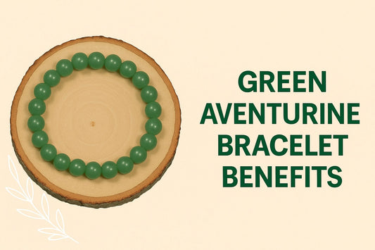 green aventurine bracelert benefits next to green bracelet on a wooden plate