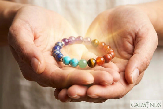 A person programming a 7 Chakra crystal bracelet for manifestation.