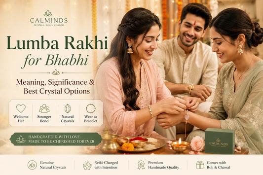 Sister tying a Rose Quartz Crystal Lumba Rakhi to her bhabhi during Raksha Bandhan celebration.