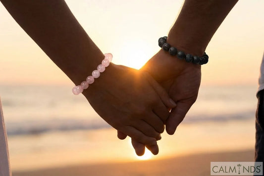 Couple holding hands wearing matching crystal bracelets for Valentine's Day 2026 gift ideas.