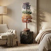 Decorative rainbow tree on a stone pedestal in a bedroom setting with a lamp and bed.