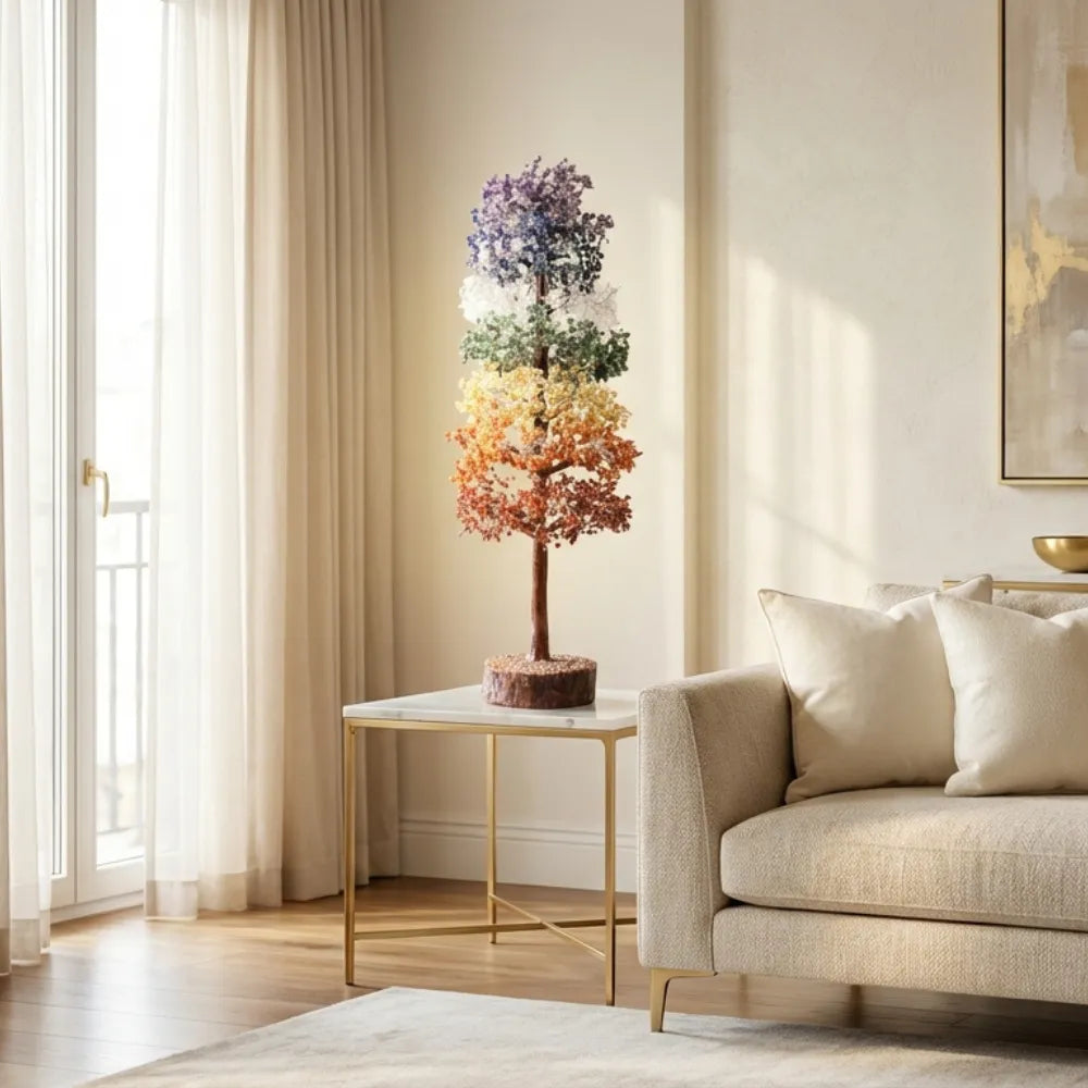 Living room with a decorative tree on a table and a beige sofa.