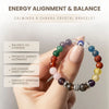 Hand holding a 9 chakra crystal bracelet with text about energy alignment and balance.