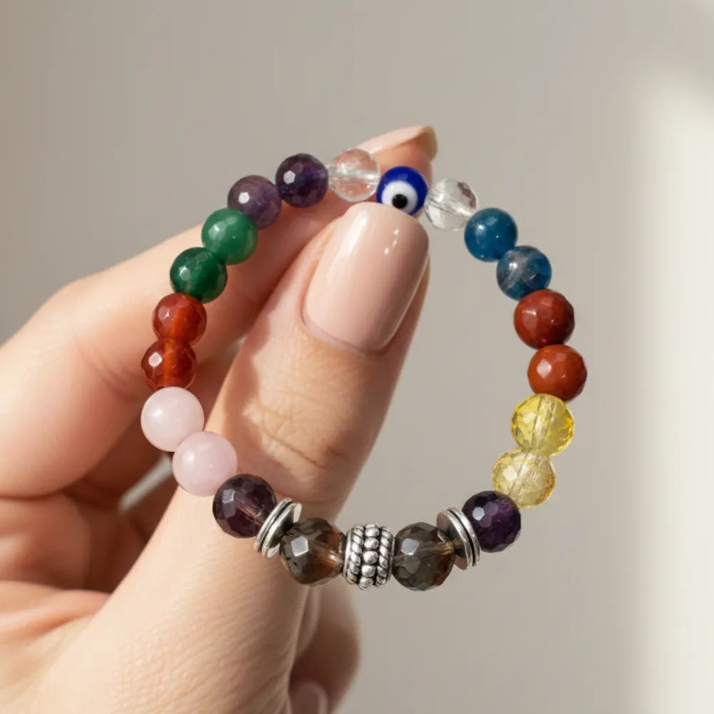 9 Multicolored beaded bracelet held by a hand against a neutral background