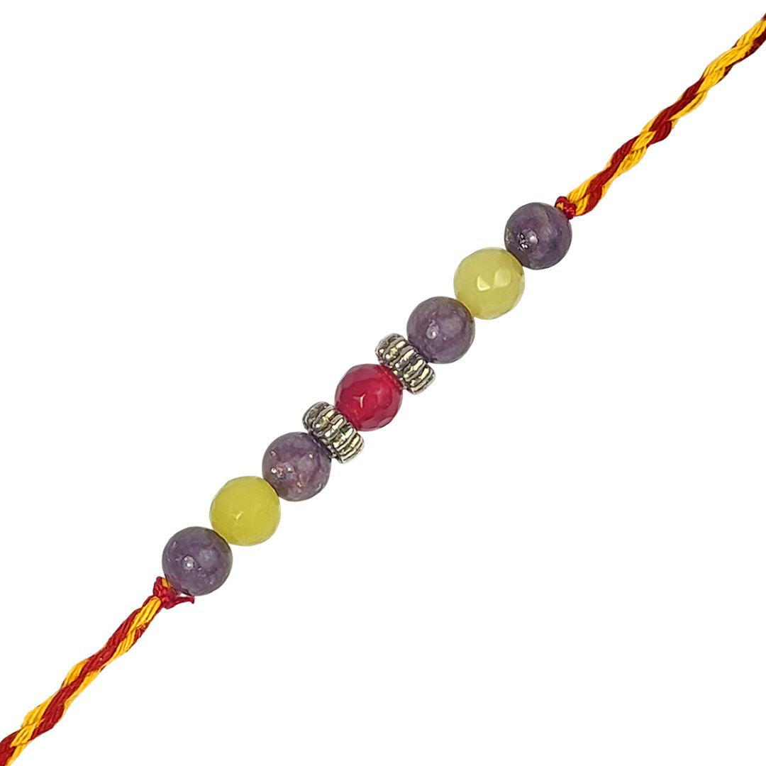 Beaded rakhi with multicolored beads on a white background