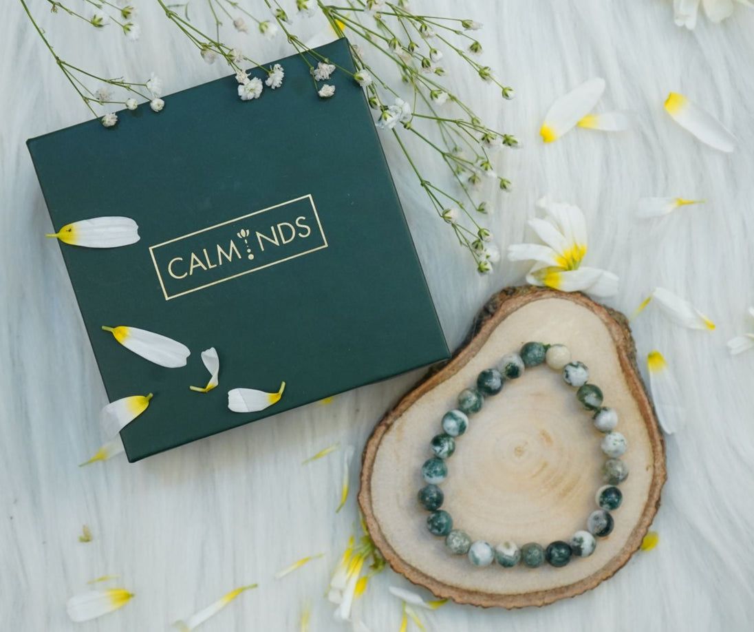 Calminds Black Rutile Quartz Healing Bracelet next to a box