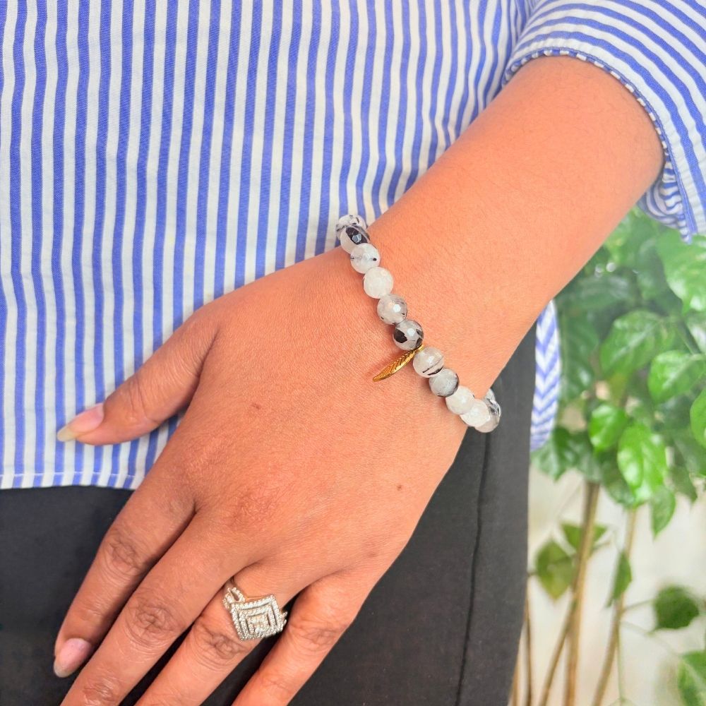 Woman wearing a Black Rutile Quartz Healing Bracelet on her left hand