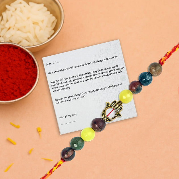 Rakhi with a card on an orange background