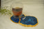 Blue Agate Crystal Coaster with a cup on top