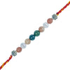 Multicolored beaded rakhi with silver charms on a white background