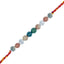Multicolored beaded rakhi with silver charms on a white background
