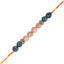 rakhi with blue and pink beads on a white background