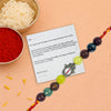 Rakhi with a card on an orange background