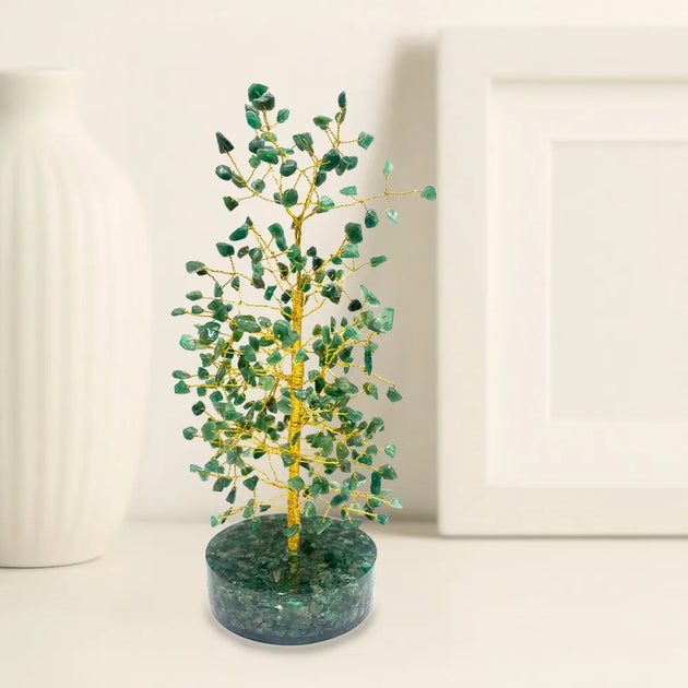 Decorative tree made of green beads on a white background