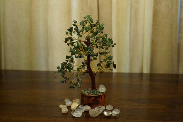 Green Aventurine Crystal Tree surrounded by white pebbles