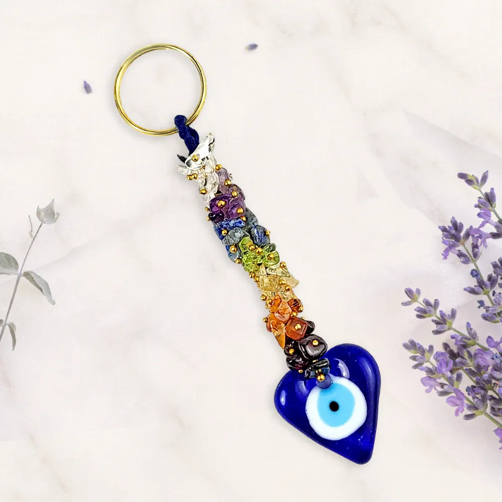 Colorful keychain with a heart-shaped evil eye charm on a white background