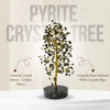 Pyrite crystal tree with text describing its components on a beige background