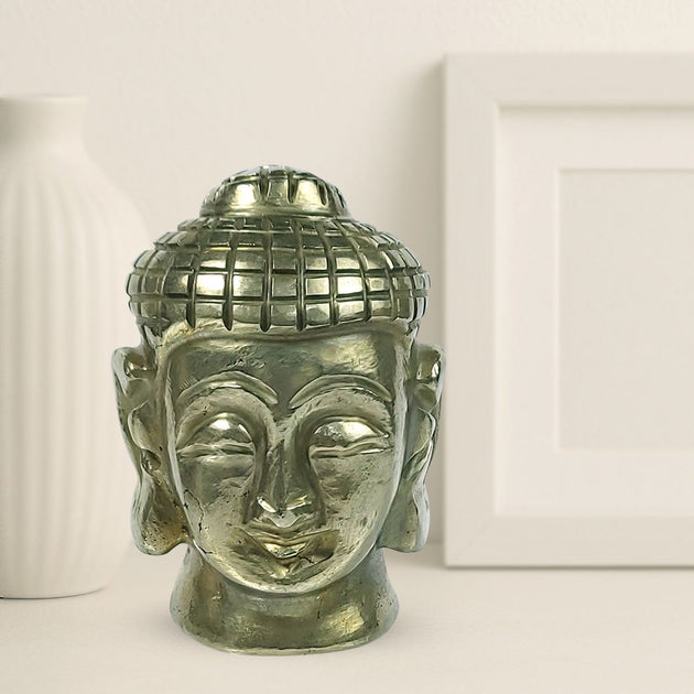 Pyrite Buddha Head with white background behind