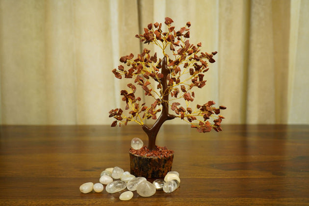 Red Jasper Crystal Tree solo image surrounded by white pebbles