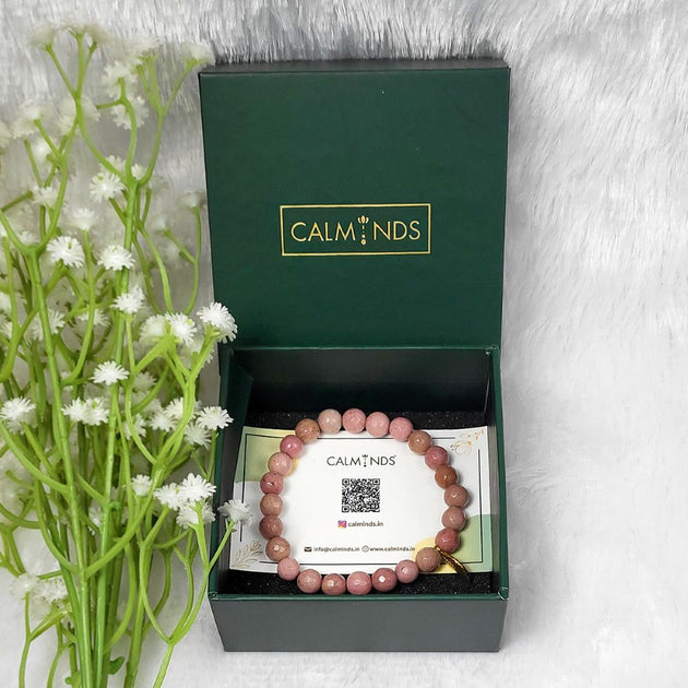 pink rhodonite healing bracelet inside green calminds box
