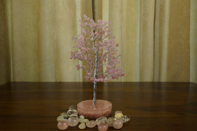 pink color Rose Quartz Crystal Tree with orgonite base and surrounded by pebbles