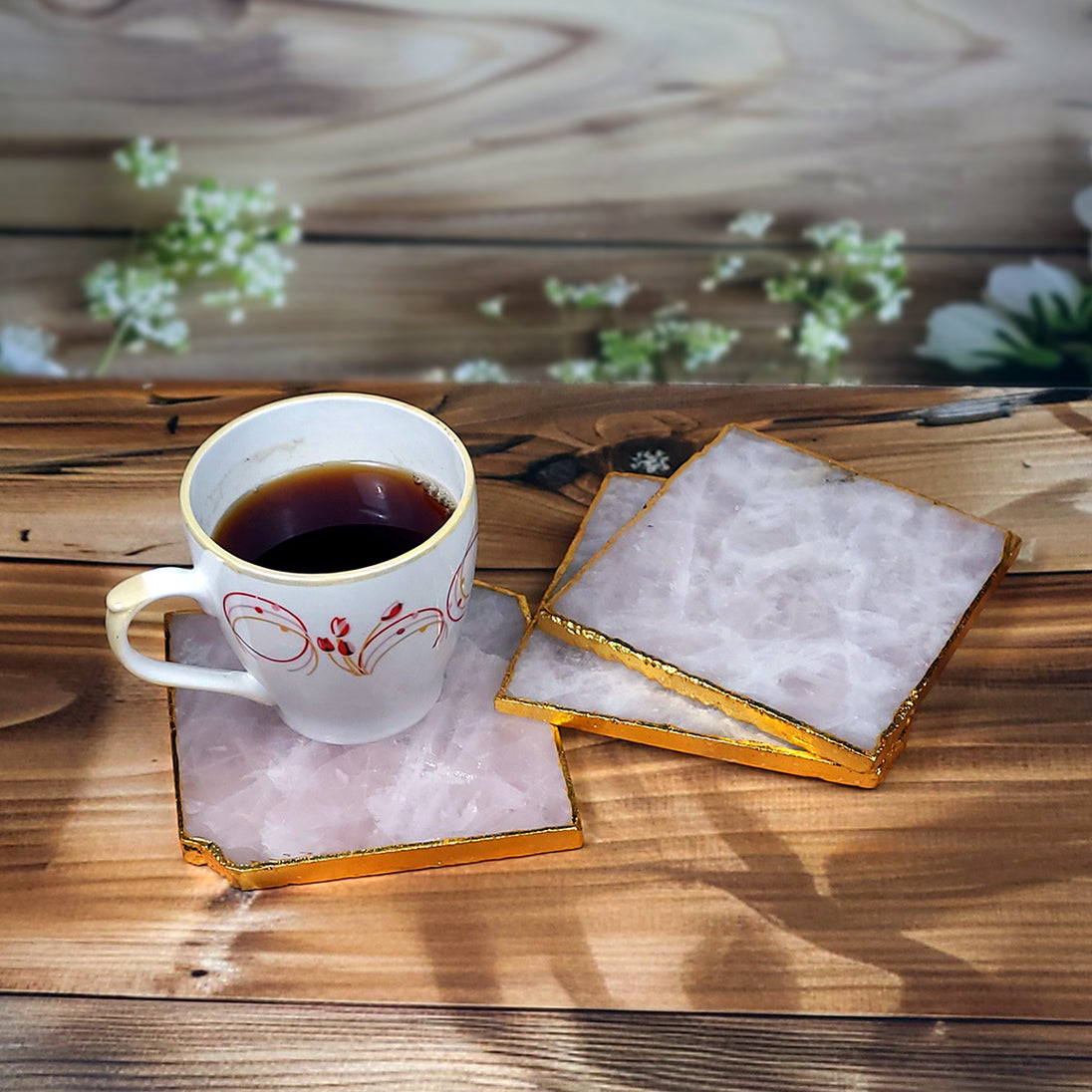 Calminds Rose Quartz Crystal Coaster with coffee mug on top