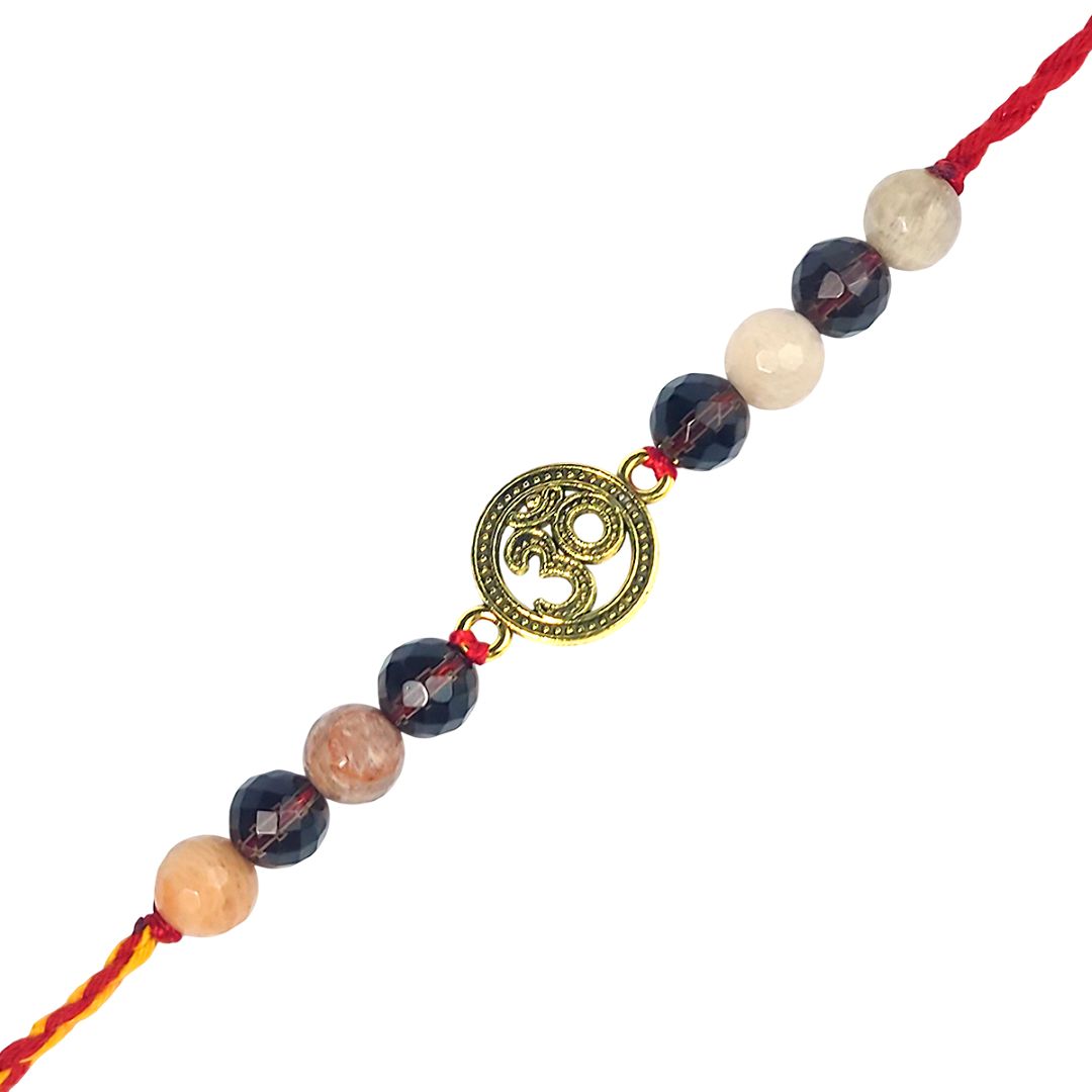 rakhi with beads and a gold Om symbol charm on a white background
